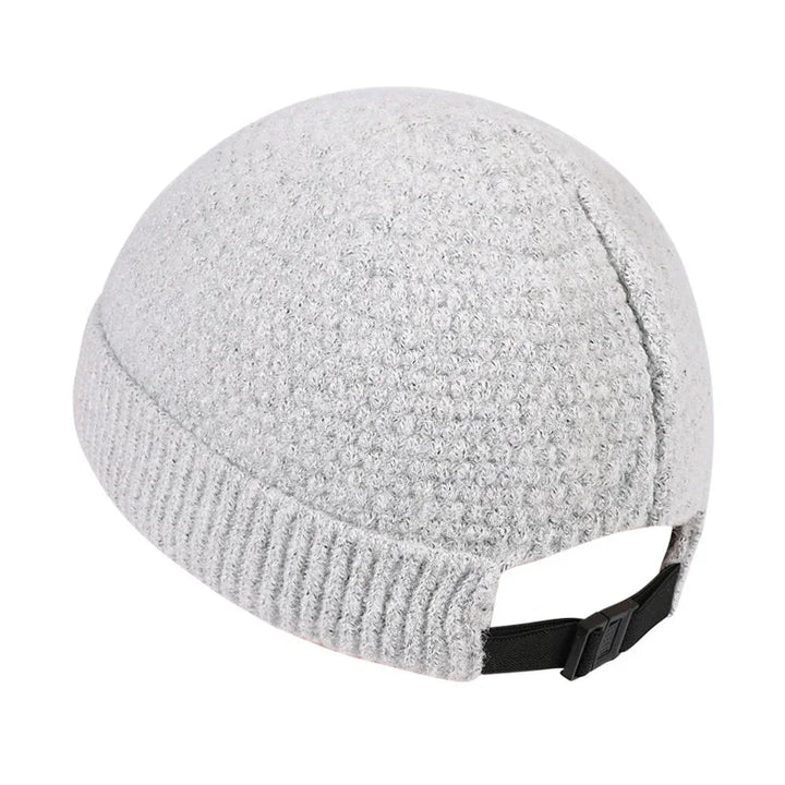 Gray textured knit beanie hat with adjustable black strap on white background