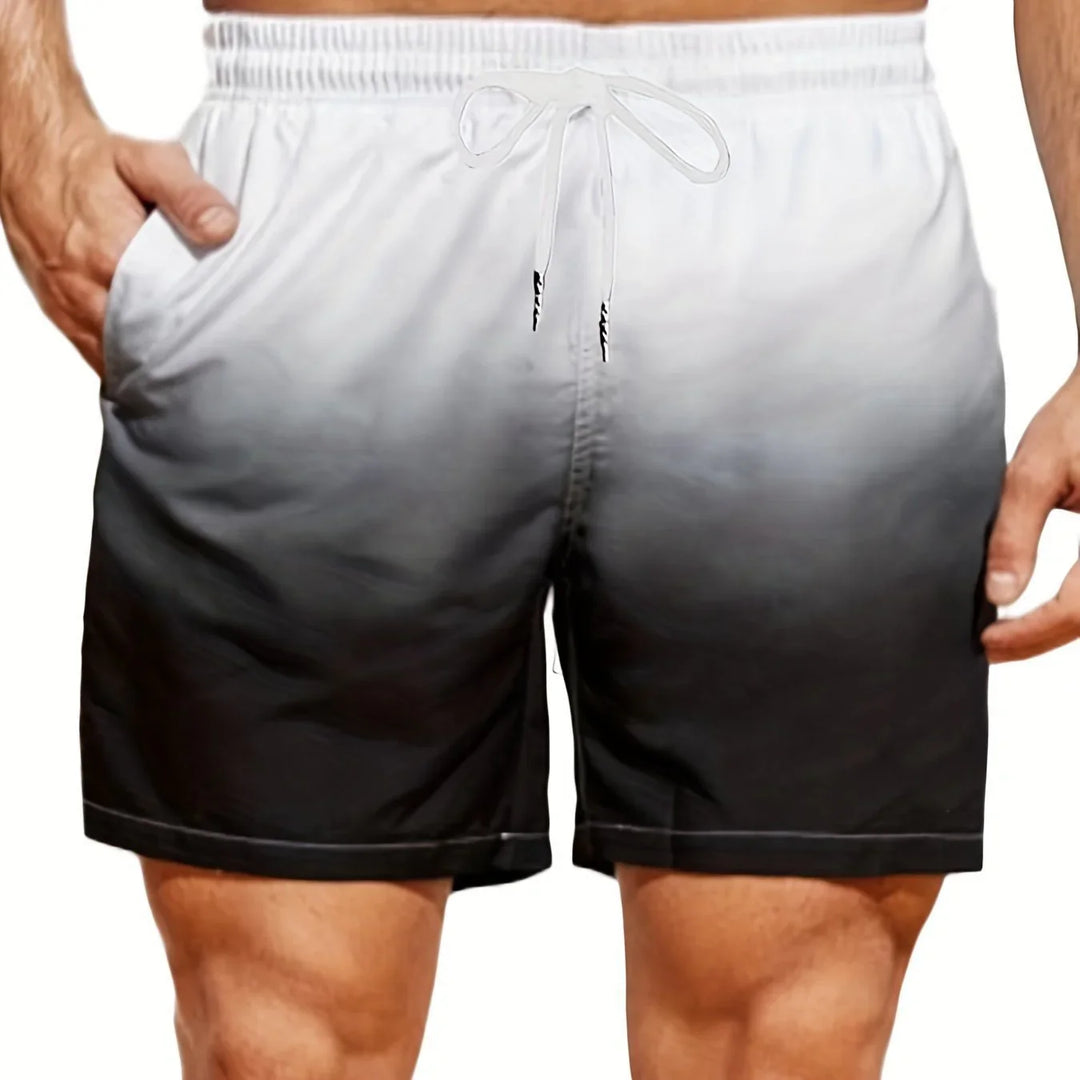 Men's black and white gradient swim shorts with elastic waistband and side pockets