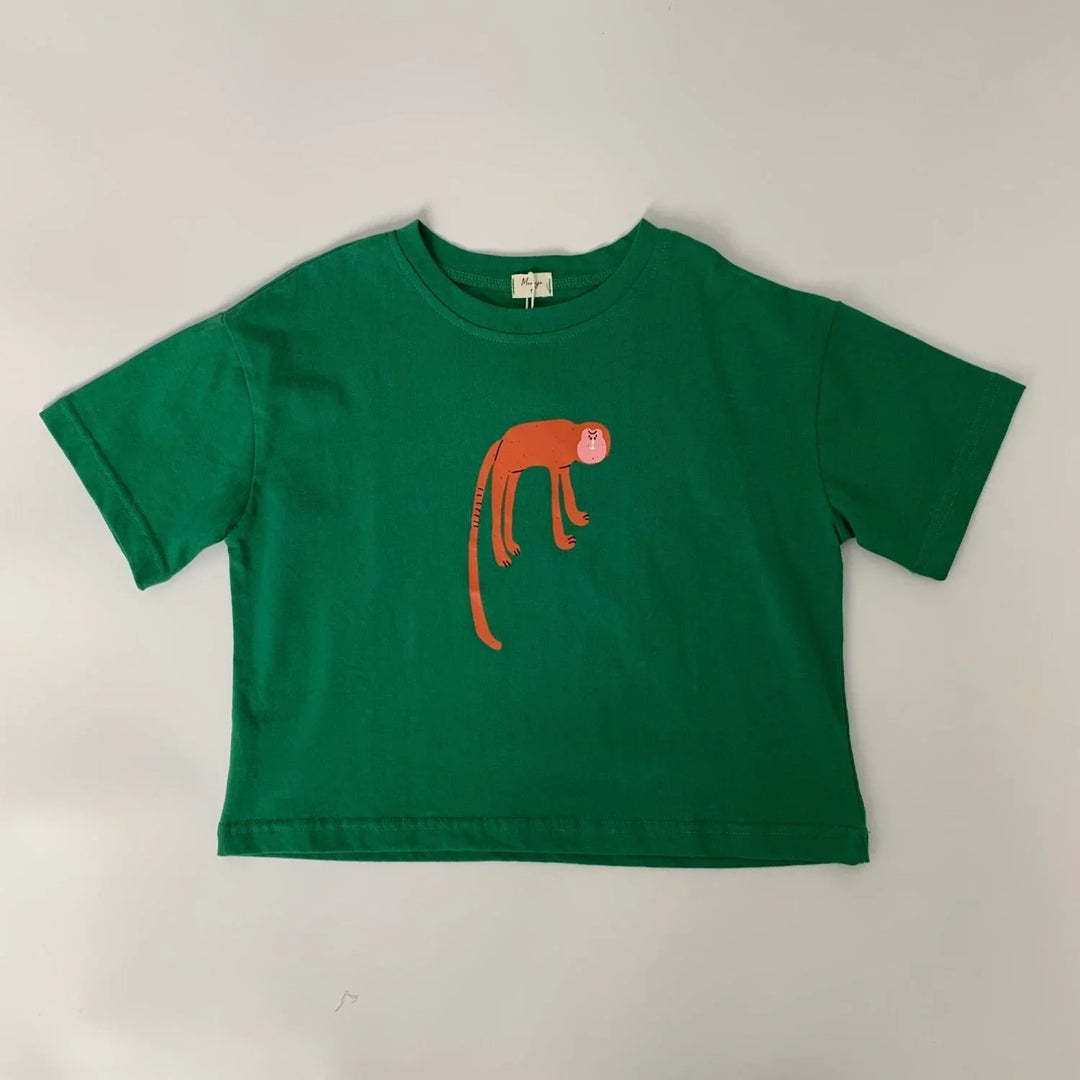 Green cropped t-shirt with cartoon orange monkey design on front