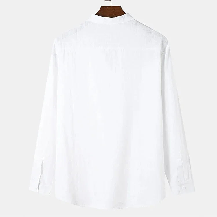 Back view of plain white long sleeve shirt hanging on wooden hanger