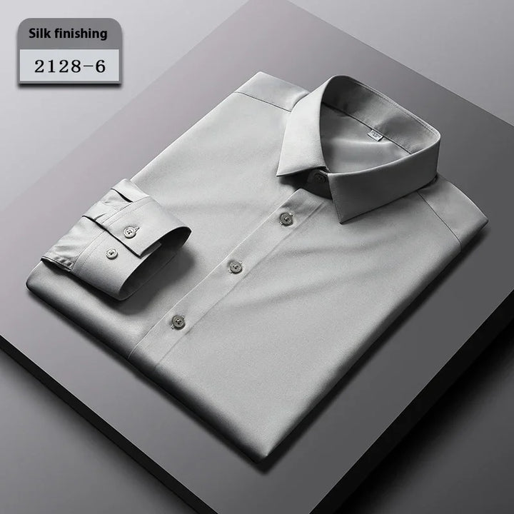 Silk finish light gray men's dress shirt folded on gray surface with tag 2128-6
