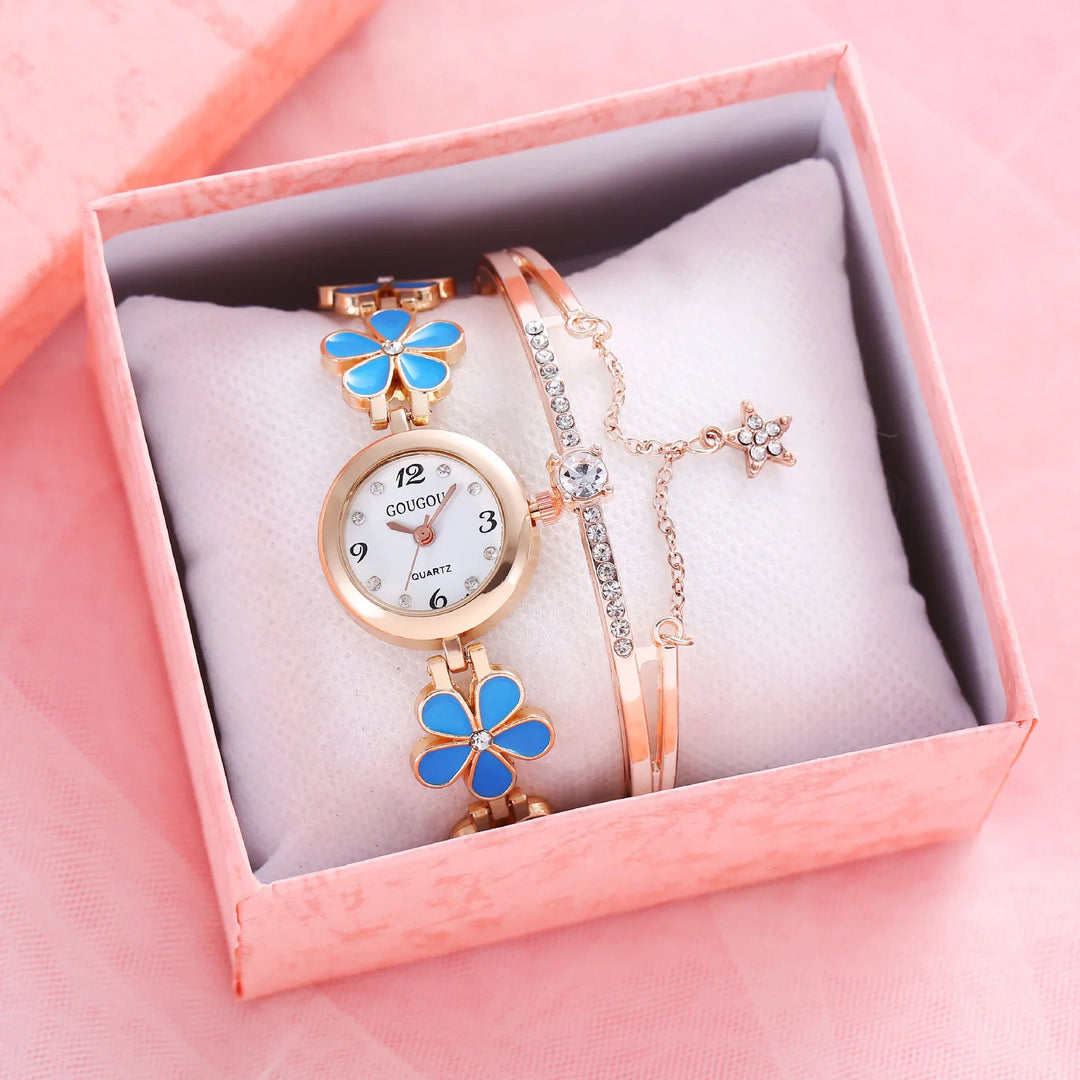 Golden women's quartz wristwatch with blue flower designs and rhinestone bracelet in pink gift box