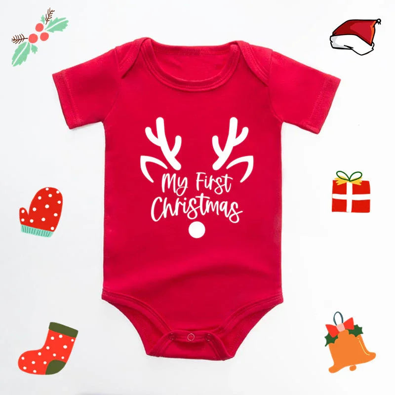 Red baby onesie with white reindeer antlers and text My First Christmas surrounded by holiday icons