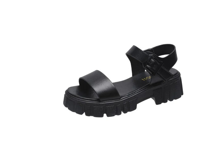 Black chunky sole sandal with broad front strap and ankle buckle strap on white background