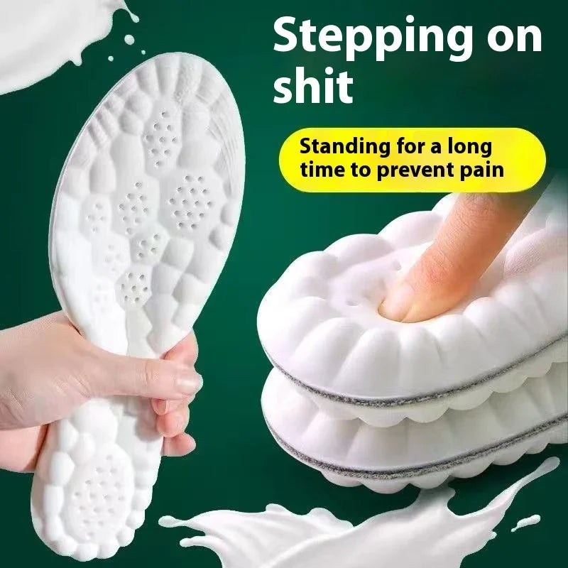 White cushioned shoe insoles held by hand, showcasing soft foam texture and comfort design