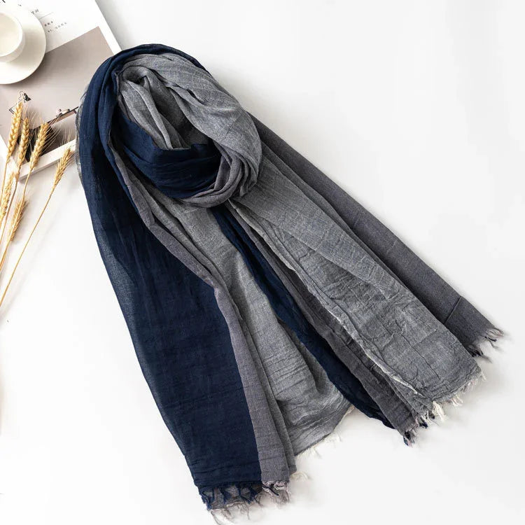 Blue and gray lightweight cotton scarf with fringed edges on white background