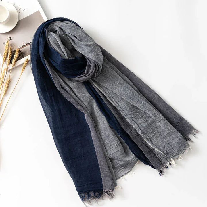 Blue and gray lightweight cotton scarf with fringed edges on white background