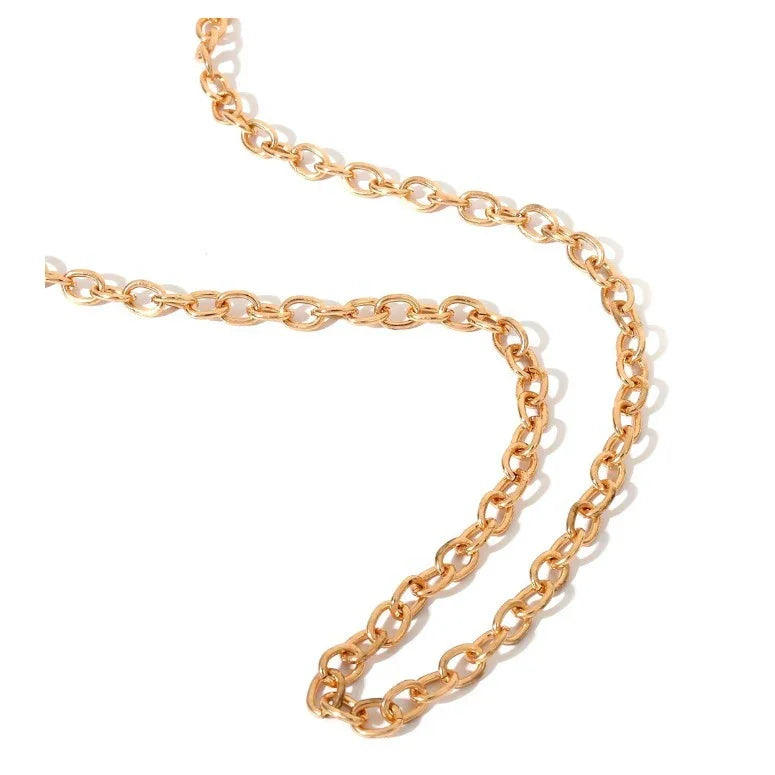 close-up of a gold metal chain with interconnected oval links on white background
