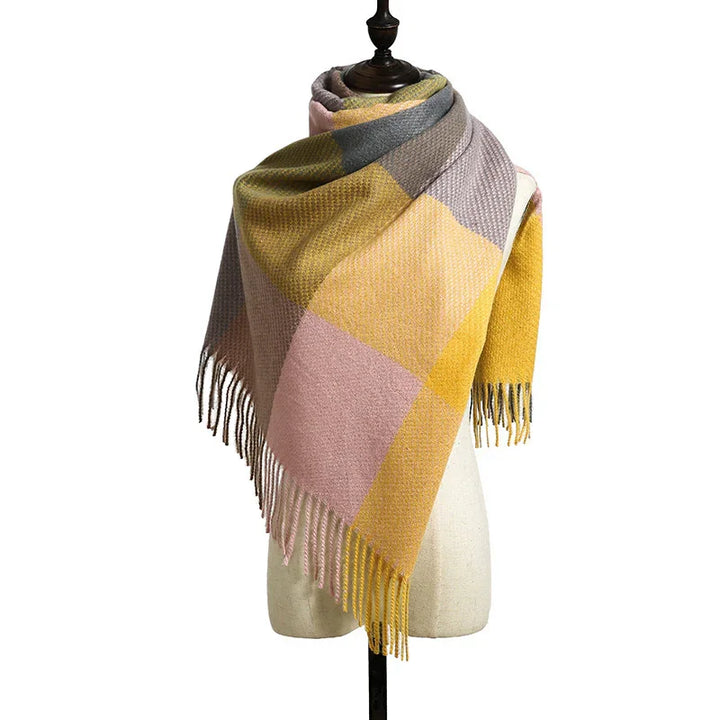 multicolor checkered wool scarf with fringes displayed on dress form against white background