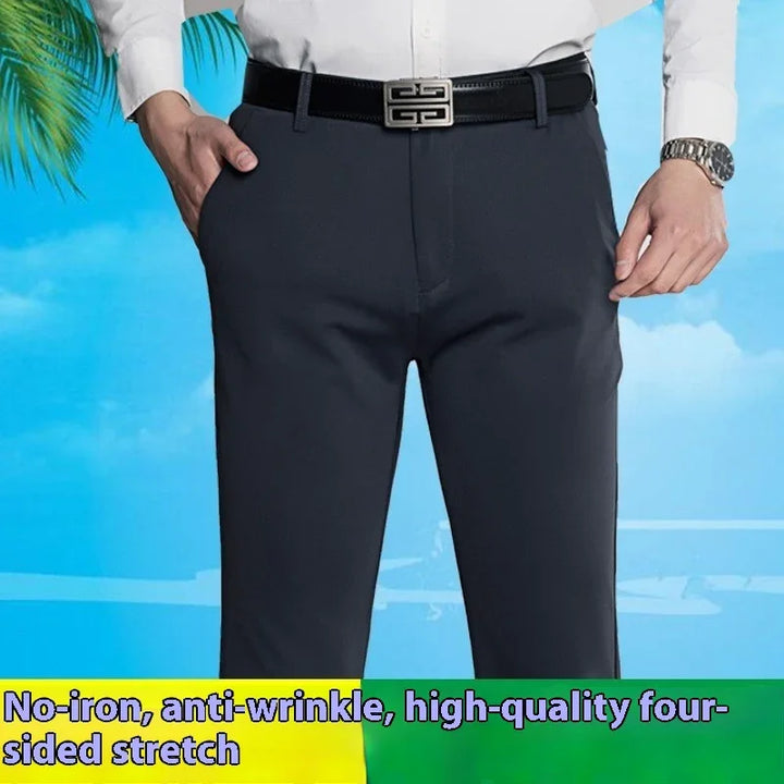 Man wearing black no-iron, anti-wrinkle stretch dress pants with a black belt and white shirt