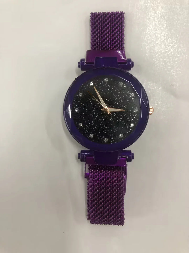Purple wristwatch with glittery black dial and mesh band on white background