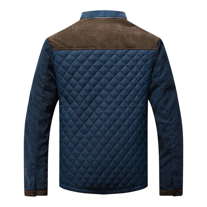 Men's quilted navy blue jacket with brown suede shoulder yoke and denim sleeves, back view
