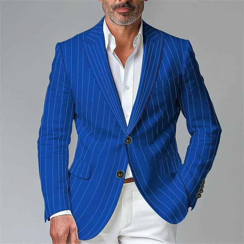 Man wearing a slim-fit blue pinstripe blazer with white dress shirt and white pants