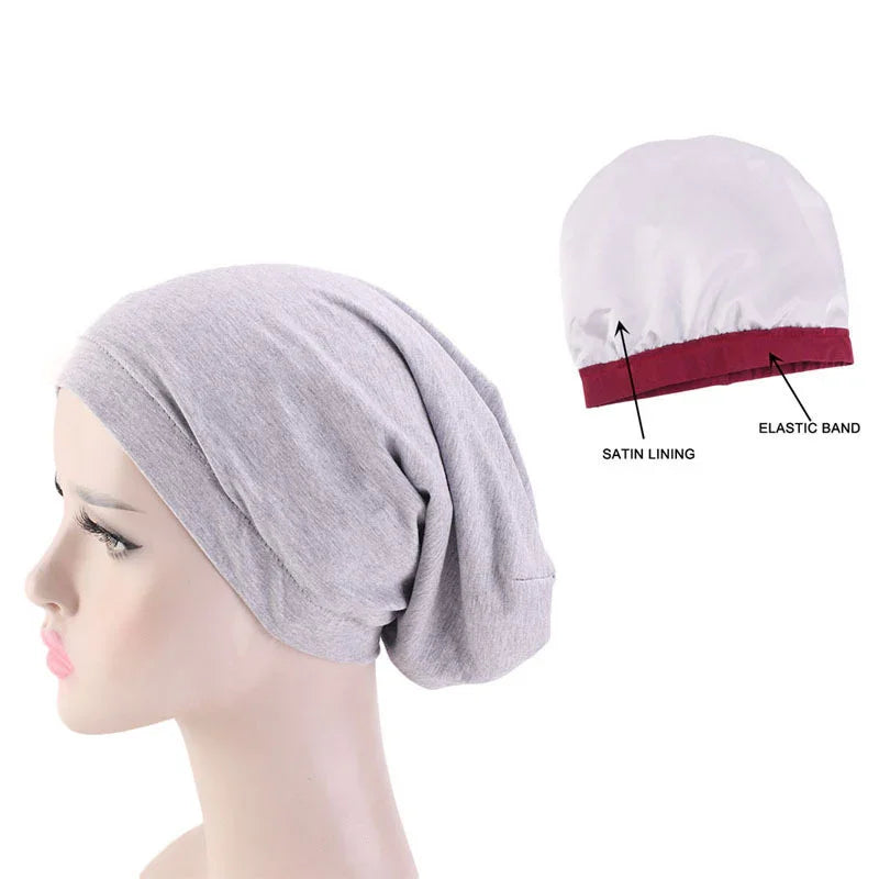 Gray slouchy beanie on mannequin with inset showing satin lining and elastic band detail