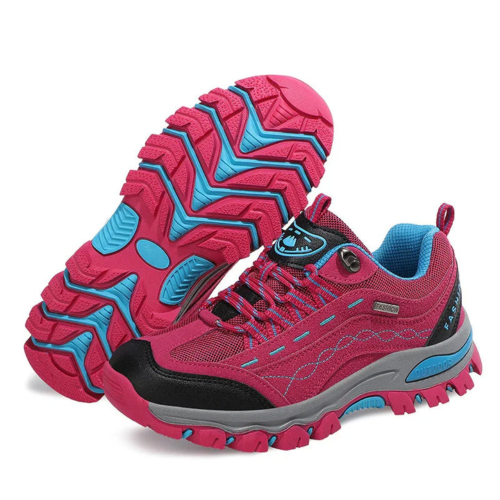 Pink and blue outdoor hiking shoes with rugged soles and breathable mesh design