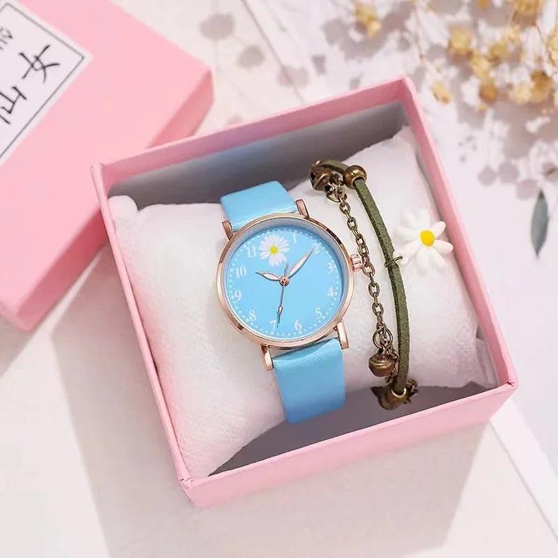 Blue daisy watch with rose gold case and green charm bracelet in pink gift box