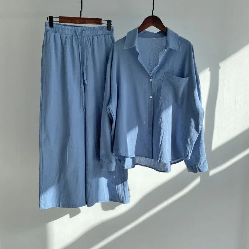 Light blue casual loungewear set with long-sleeve button shirt and elastic waist pants hanging