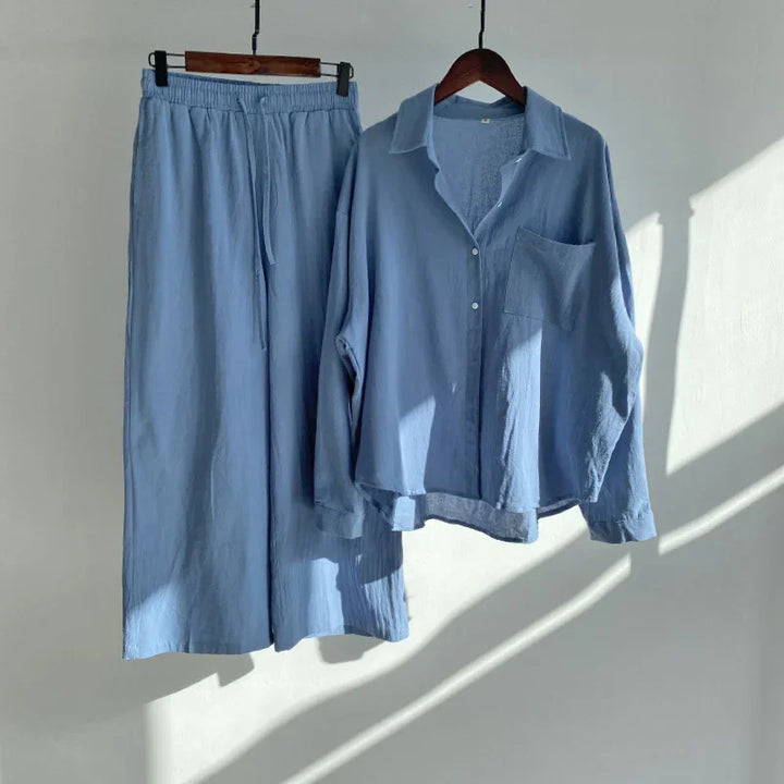 Light blue casual loungewear set with long-sleeve button shirt and elastic waist pants hanging