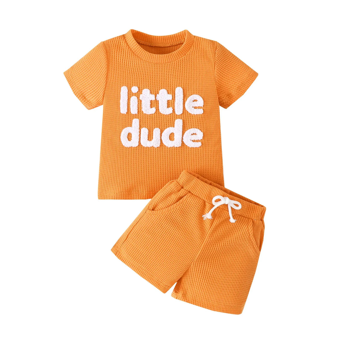 Orange toddler short sleeve shirt with 'little dude' text and matching drawstring shorts set
