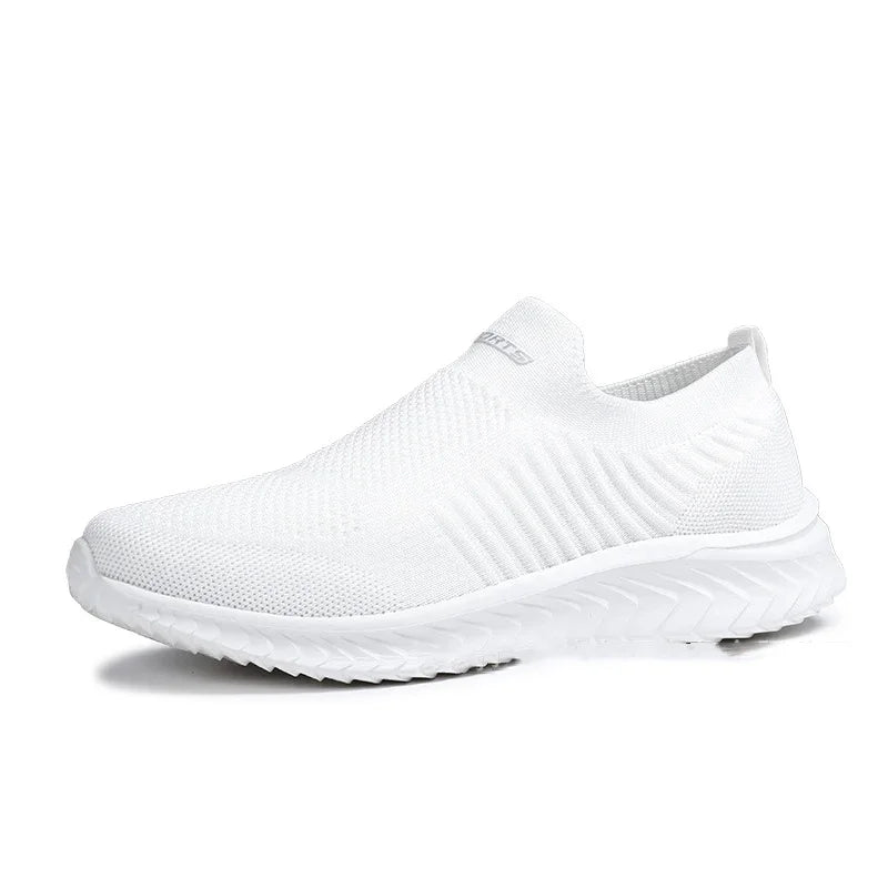 All-white slip-on knit sneaker with textured sole and breathable mesh upper
