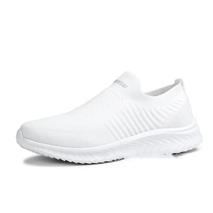 All-white slip-on knit sneaker with textured sole and breathable mesh upper