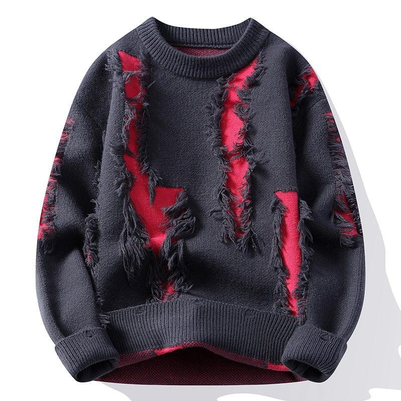 Dark gray distressed knit sweater with red fabric patches visible through ripped details