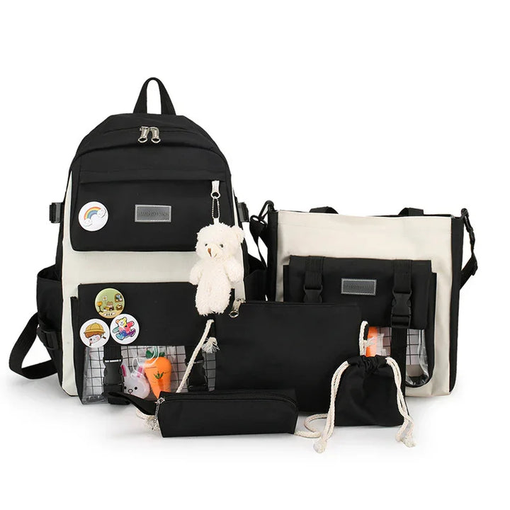 Black and white backpack set with multiple pouches, pins, and a teddy bear keychain on white background