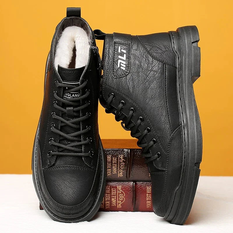 Black leather winter boots with fur lining and lace-up design, displayed on stacked books