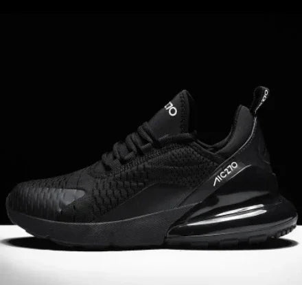 Black AC210 athletic sneaker with textured mesh upper and cushioned air sole on black background
