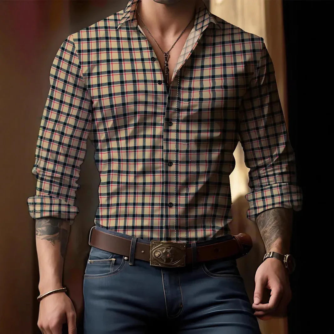 Man wearing beige plaid shirt with rolled sleeves, brown belt, and blue jeans indoor