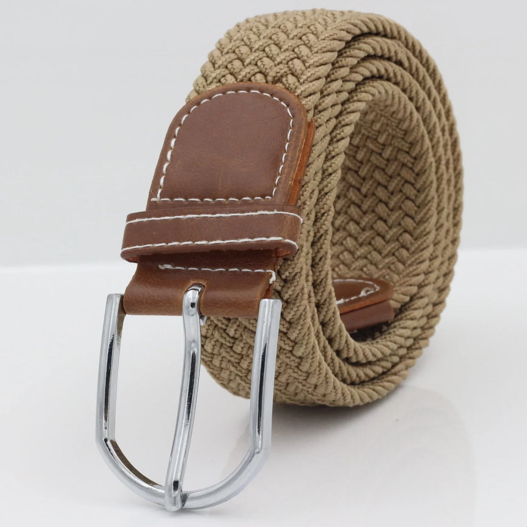 Beige braided fabric belt with brown leather buckle and silver metal clasp on white background