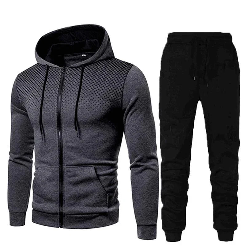Men's athletic two-piece outfit with dark gray zip-up hoodie featuring textured shoulders and black jogger pants