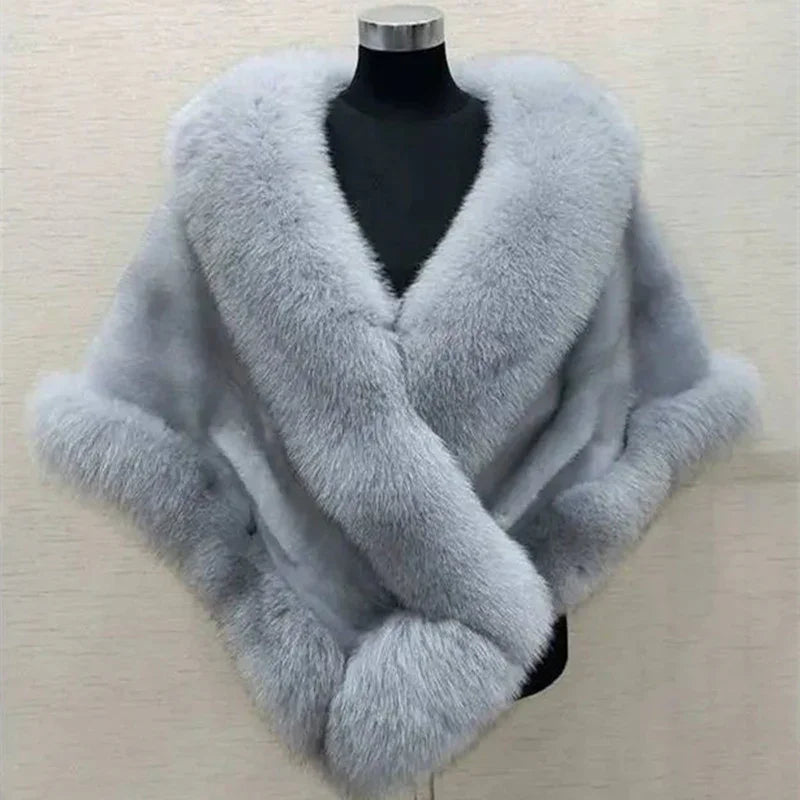 Elegant light gray fur shawl with soft texture displayed on black mannequin