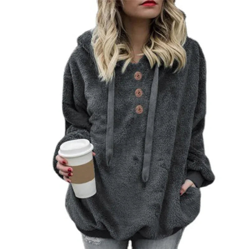 Woman wearing cozy dark gray fleece hoodie with buttons, holding takeaway coffee cup