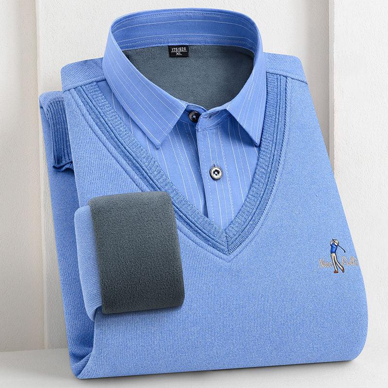 Folded blue V-neck sweater with a blue pinstripe dress shirt layered underneath on white background