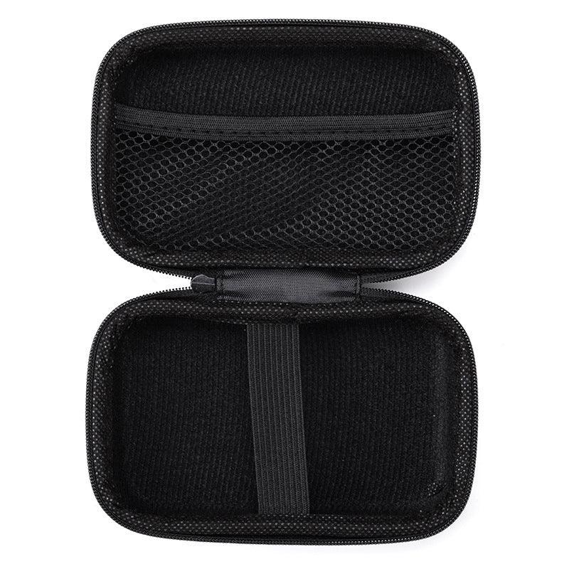 Black hard shell travel case with mesh pocket and elastic strap, open and empty