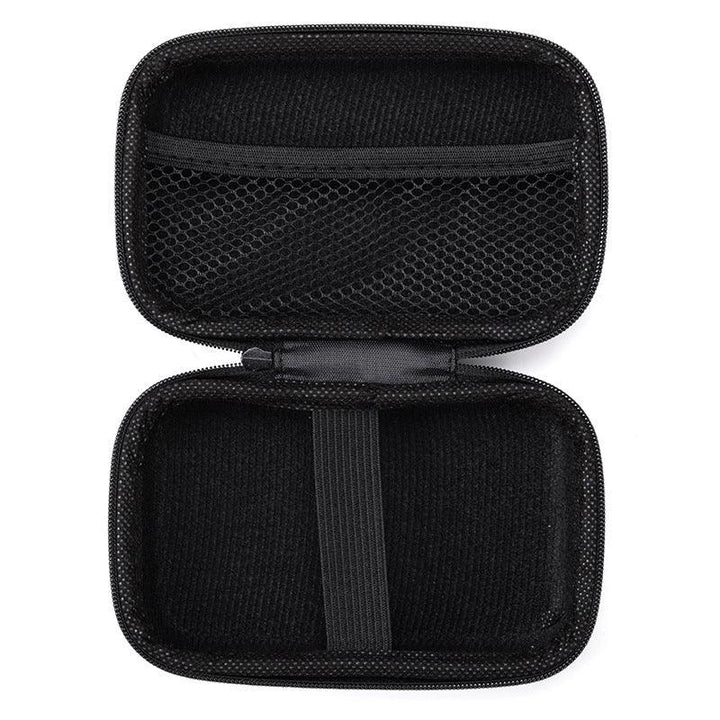 Black hard shell travel case with mesh pocket and elastic strap, open and empty