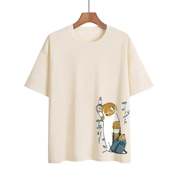 Beige T-shirt with cartoon cat holding a subway strap and a blue backpack with a hamster peeking out
