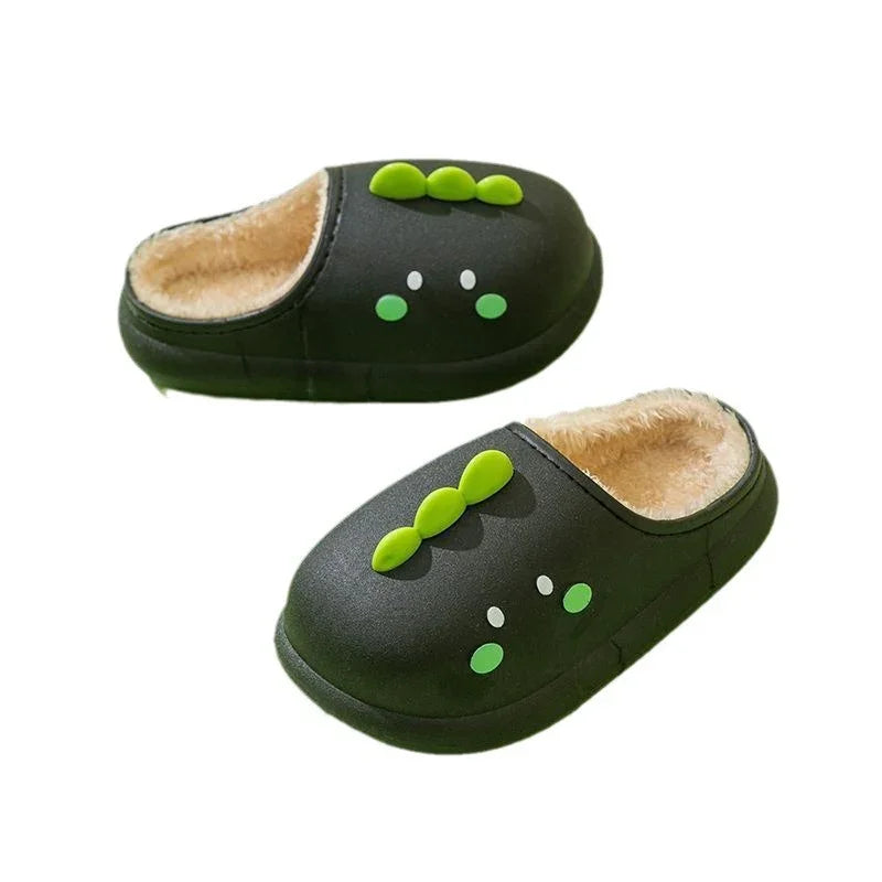 Black slip-on slippers with soft beige fur lining and green dinosaur spike and eye designs