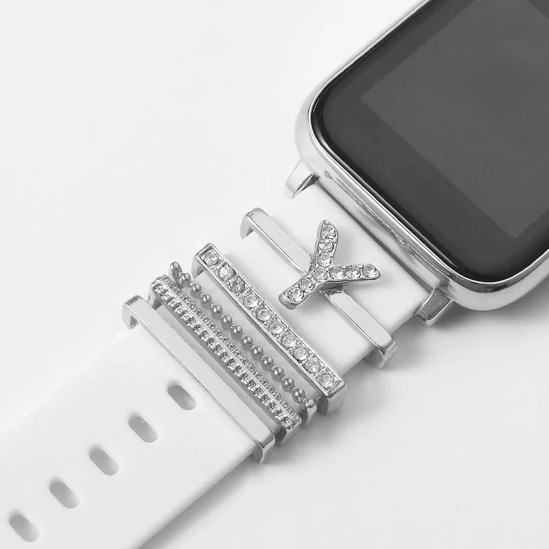 White smartwatch with silver and rhinestone decorative letter Y and bands on strap
