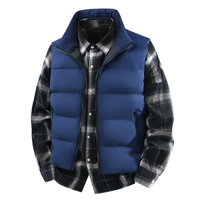 blue puffer vest layered over black and white plaid shirt on white background