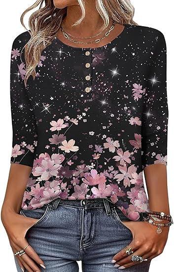Black floral buttoned top with pink flowers, half sleeves, modeled with blue jeans and jewelry