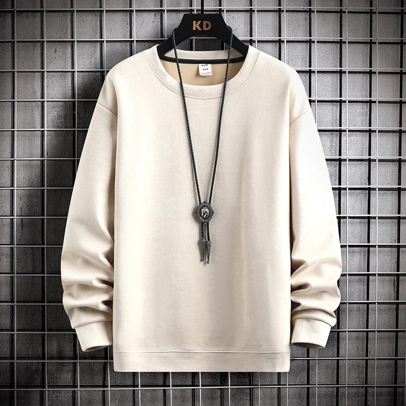 Beige long-sleeve sweatshirt on hanger with black necklace against metal grid background