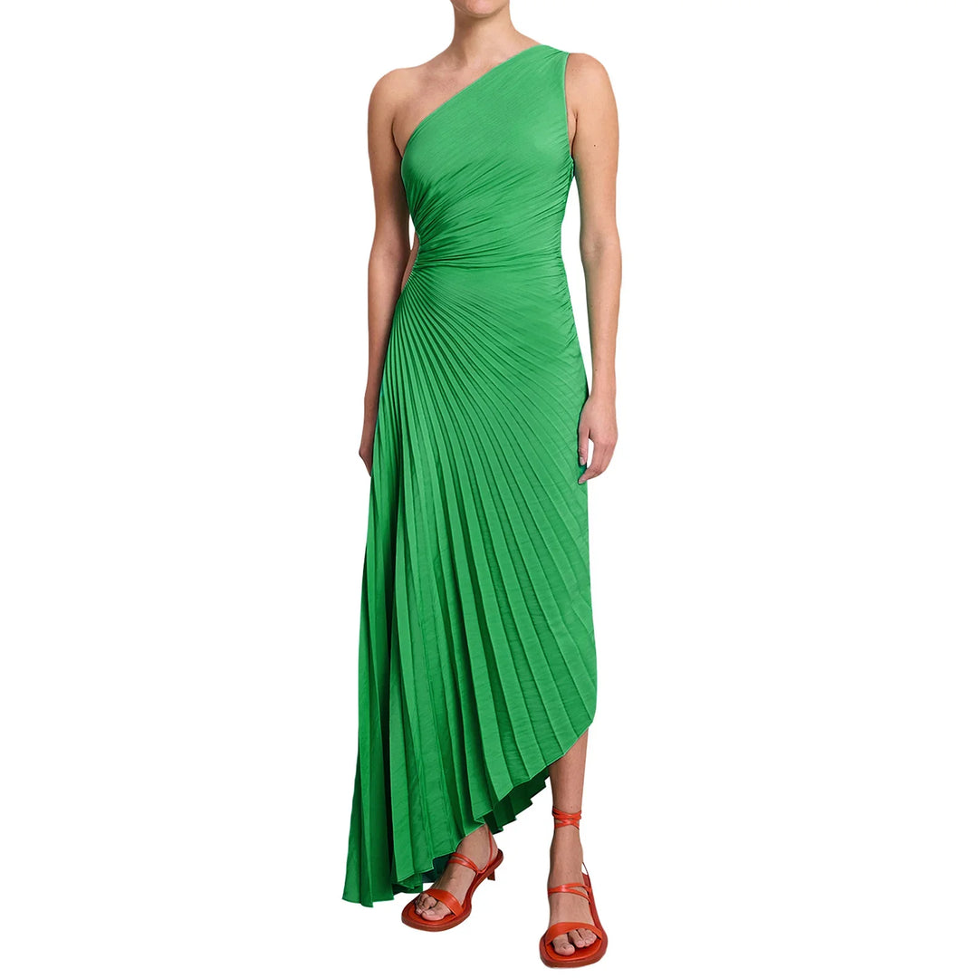 Woman wearing green one-shoulder pleated midi dress with orange strappy sandals