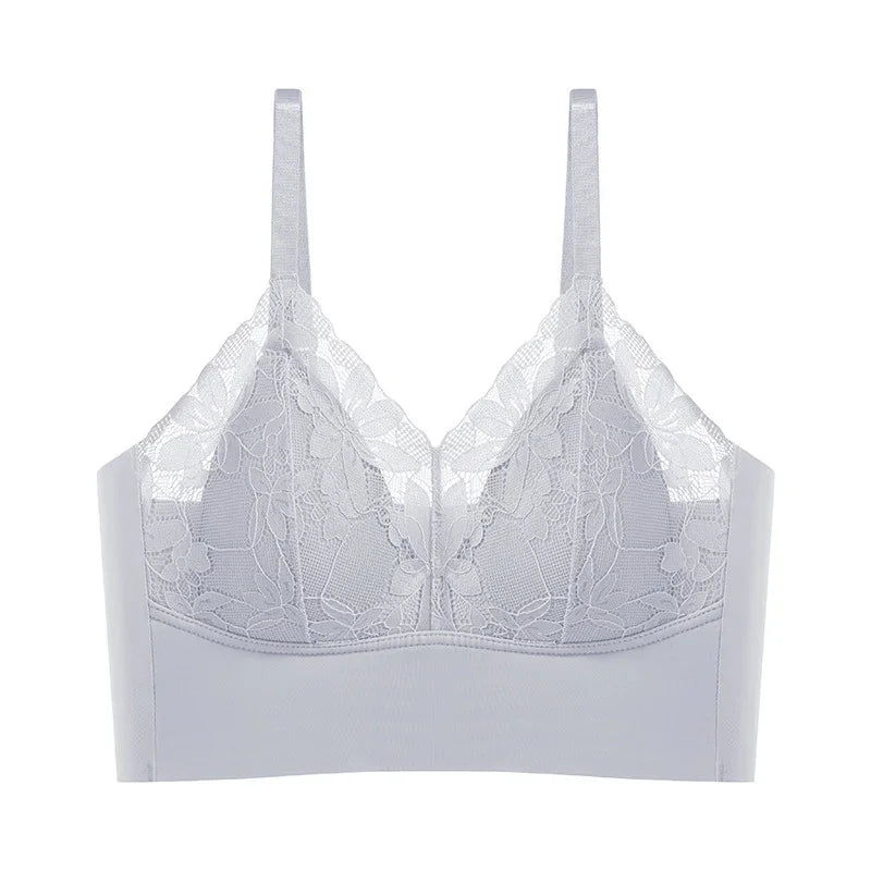 White lace bralette with floral pattern and adjustable straps on white background