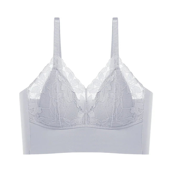 White lace bralette with floral pattern and adjustable straps on white background