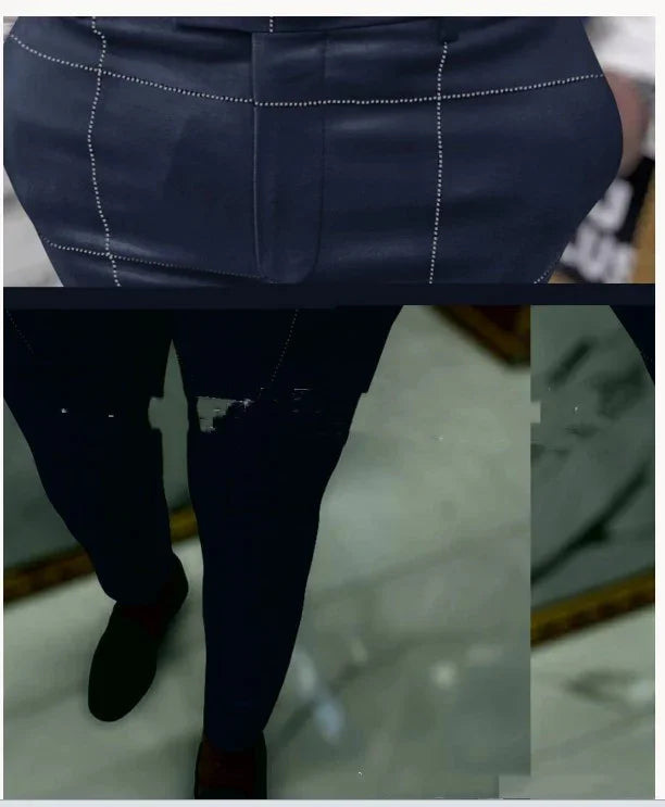 Man wearing navy blue checkered suit pants and black dress shoes standing on marble floor