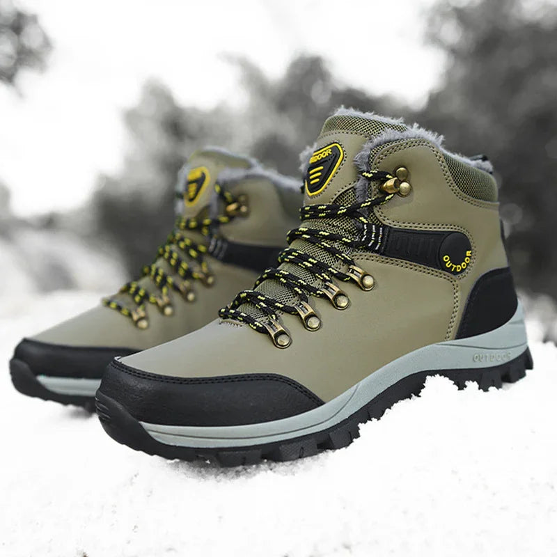 Olive green and black waterproof outdoor hiking boots with yellow accents on snow