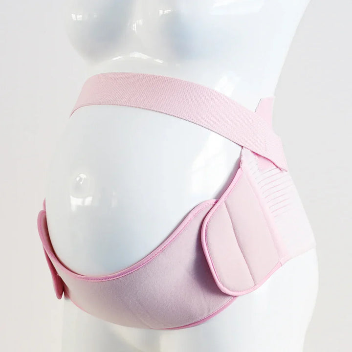 Pink maternity belt support worn on a white mannequin torso for pregnancy comfort