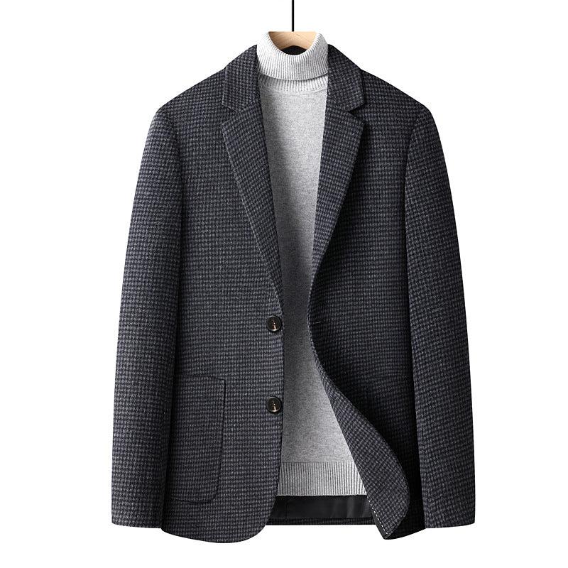 dark gray houndstooth blazer paired with light gray turtleneck sweater on wooden hanger